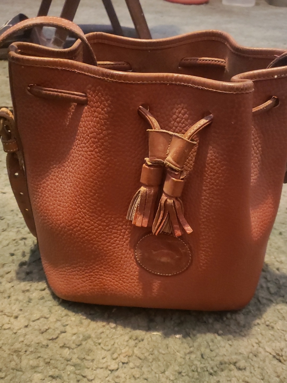 Dooney & Bourke Cognac Pebbled Leather Drawstring Bucket Bag. 9in Tall 9in Lgth